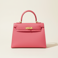 Polished pink handbag product photo
